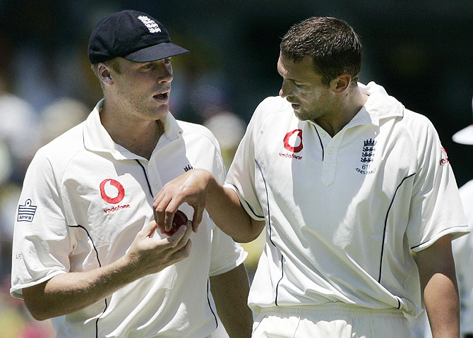 England's Andrew Flintoff (left) has a word with pace bowler Steve Harmison