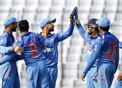 Indian players celebrate after Ravindra Jadeja (2nd left) dismisses Afghanistan's Noor Ali Zadran