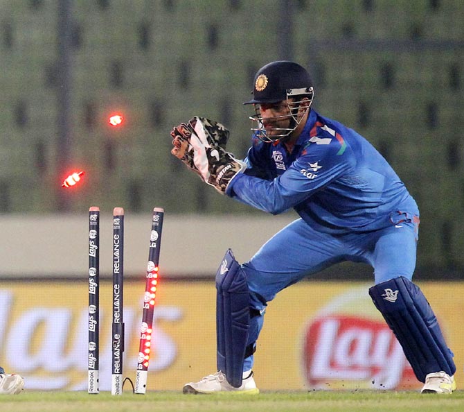 India captain Mahendra Singh Dhoni whips off the bails to effect a stumping during the World T20.