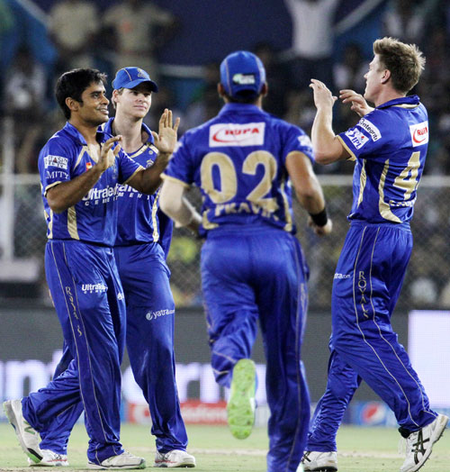 Rajasthan Royals players celebrate the fall of a Delhi Daredevils wicket