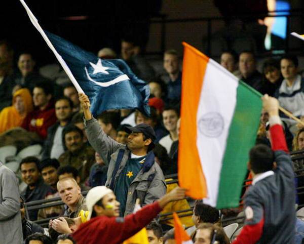 Pakistan and India supporters watch the match in the stands during the fifth Pakistan v India One-Day International at the Gadaffi Stadium on March 24, 2004 in Lahore.