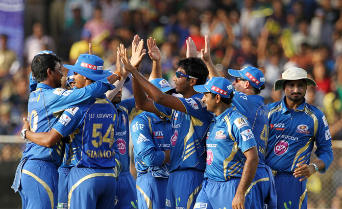 Mumbai Indians players celebrate a wicket
