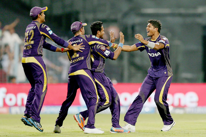 Umesh Yadav is congratulated by his Kolkata Knight Riders' teammates after taking a wicket