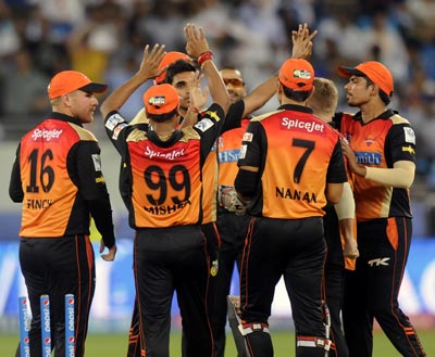 Bhuvneshwar Kumar is congratulated by his Sunrisers teamates after the wicket of Rohit Sharma