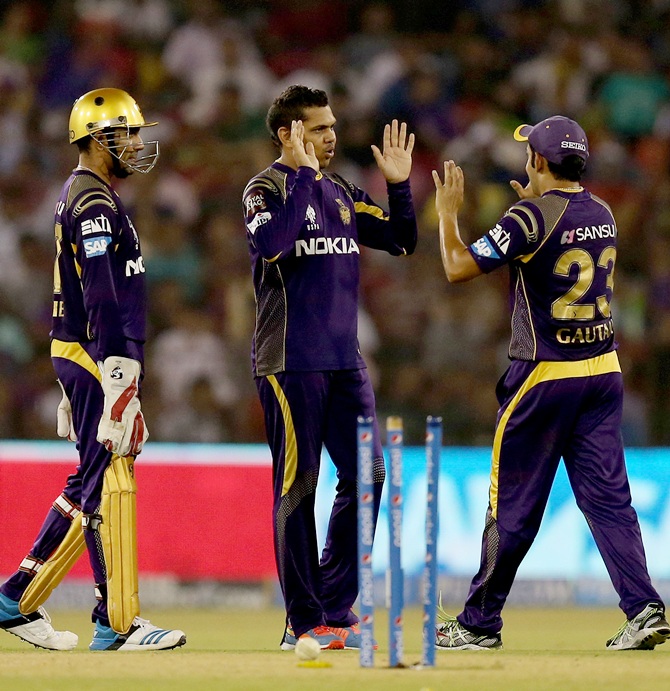 Sunil Narine is congrtulated by KKR captain Gautam Gambhir after taking a wicket