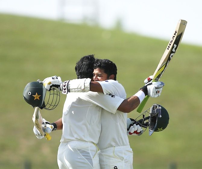 Azhar Ali of Pakistan celebrates after reaching his century with Misbah-ul Haq