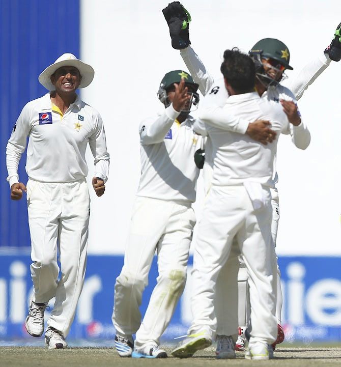 Pakistan player Yasir Shah celebrates with teammates