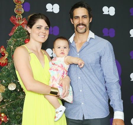 Mitchell Johnson of Australia poses with his wife Jessica Bratich-Johnson and daughter Rubika 