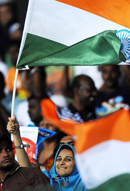  An Indian supporter waves the national flag during the super eight match between Pakistan and India held at R. Premadasa Stadium on September 30, 2012 in Colombo, Sri Lanka 