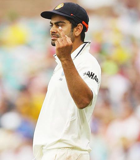 Virat Kohli of India gestures with his middle finger to the crowd during day two of the Second Test Match between Australia and India at the Sydney Cricket Ground