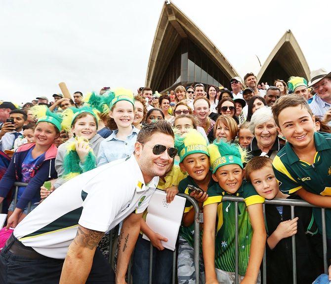 Michael Clarke pose with fans