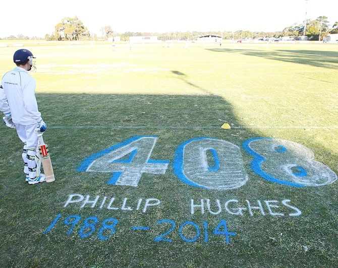 A batsman for Langwarrin U/16 waits to bat in a match played against Mount Eliza, and was   dedicated to Phil Hughes, at Lloyd Park in Langwarrin