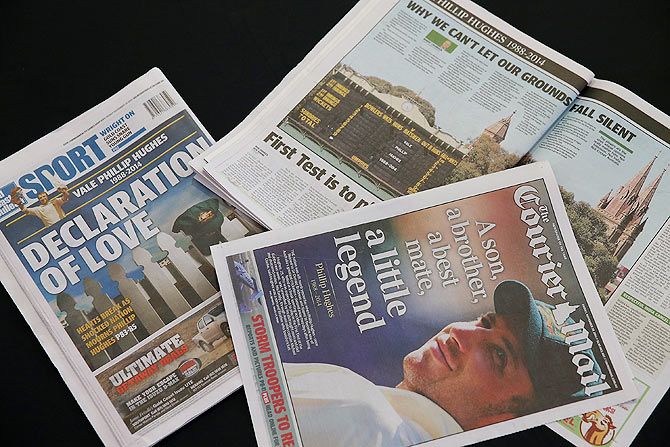 Front pages of the Queensland daily newspapers on Friday show headlines surrounding the death of Phillip Hughes