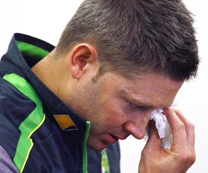 Australian cricket captain Michael Clarke wipes his eyes as he cries