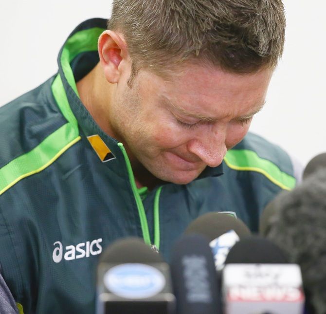 Australian cricket captain Michael Clarke pauses as he reads a statement