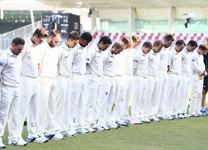 Players of New Zealand line up before the start of play to observe a minute's silence in memory of Australian cricketer Phillip Hughes