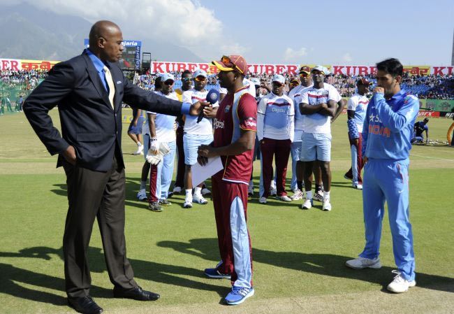 West Indies skipper Dwayne Bravo speaks to Ian Bishop at the toss on Friday