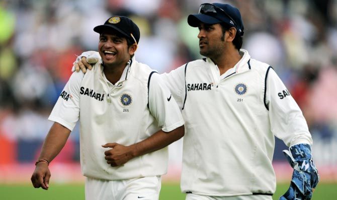 India captain Mahendra Singh Dhoni (right) with Suresh Raina