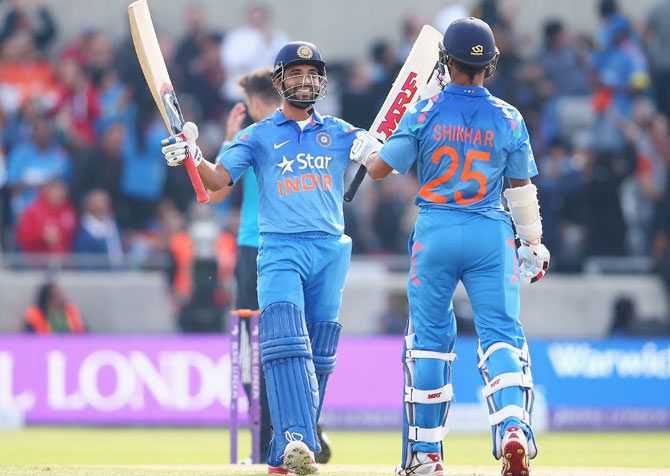 India's Shikhar Dhawan is congratulated by teammate Ajinkya Rahane during the fourth one-dayer against England at Edgbaston