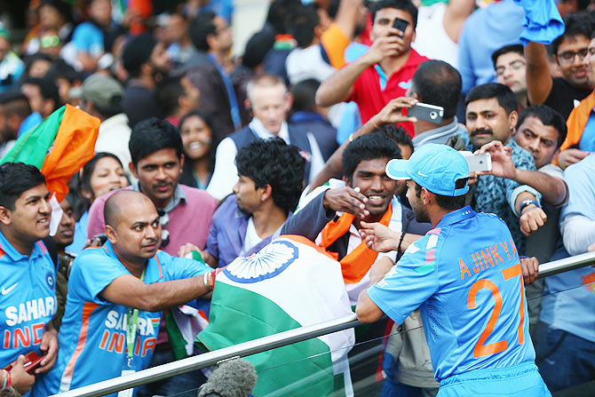Ajinkya Rahane of India signs autographs after India's ODI series against England at Edgbaston on September 2, 2014.
