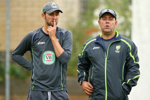  Nathan Lyon of Australia and Darren Lehmann, coach of Australia look on during a training Session 