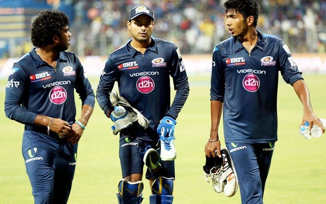 From left, Mumbai Indians players Lasith Malinga, Aditya Tare and Jasprit Bumrah