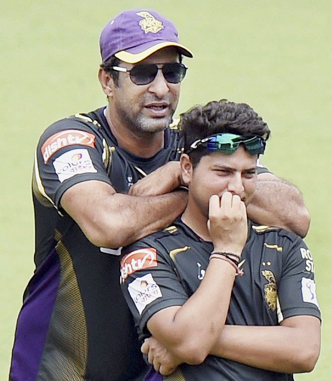 KKR's Kuldeep Yadav with bowling coach Wasim Akram during a practice session