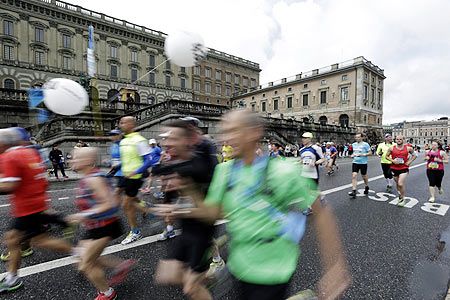 Athletes run past the Royal Palace during the Stockholm marathon