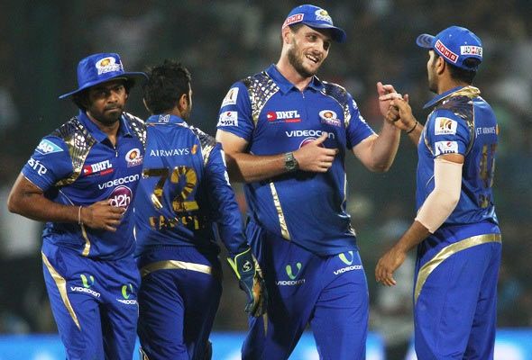 Mitchell McClenaghan of Mumbai Indians is congratulated by his captain Rohit Sharma for getting Angelo Mathews of the Delhi Daredevils out