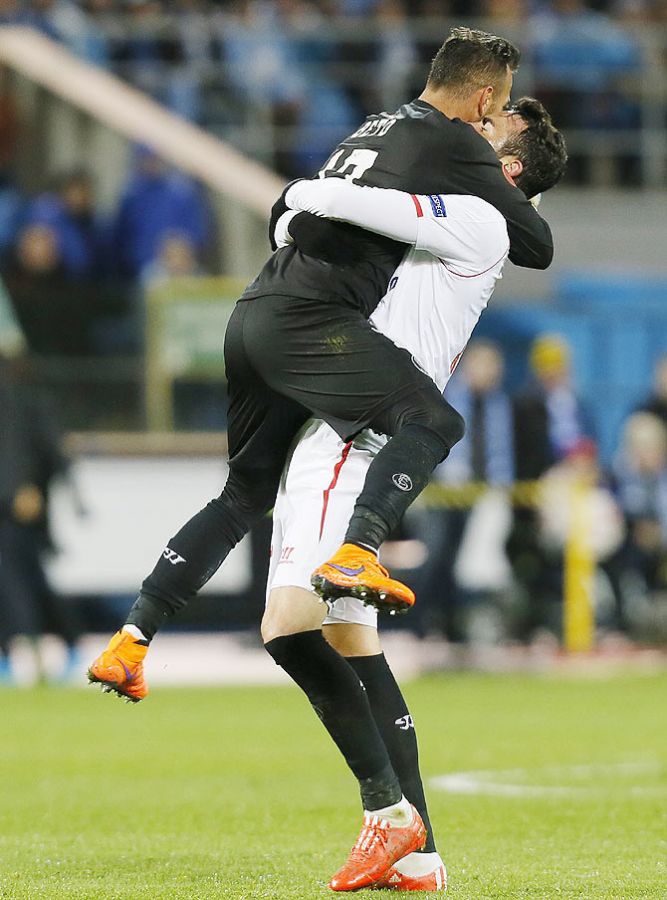 Sevilla's Vicente Iborra (right) and goalkeeper Beto celebrate after Kevin Gameiro (not pictured) scored a goal against Zenit St. Petersburg during their Europa League quarter-final, second leg match at the Petrovsky stadium in St. Petersburg on Thursday