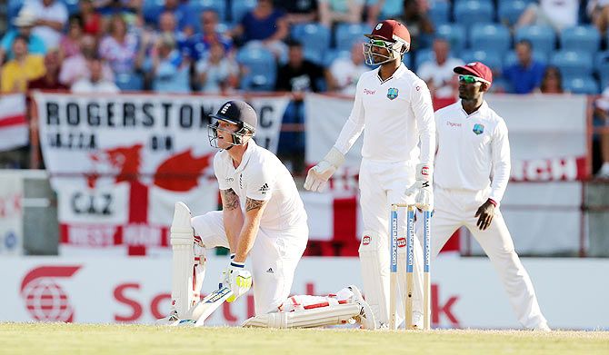 England's Ben Stokes hits a shot only to be caught by West Indies' Jermaine Blackwood
