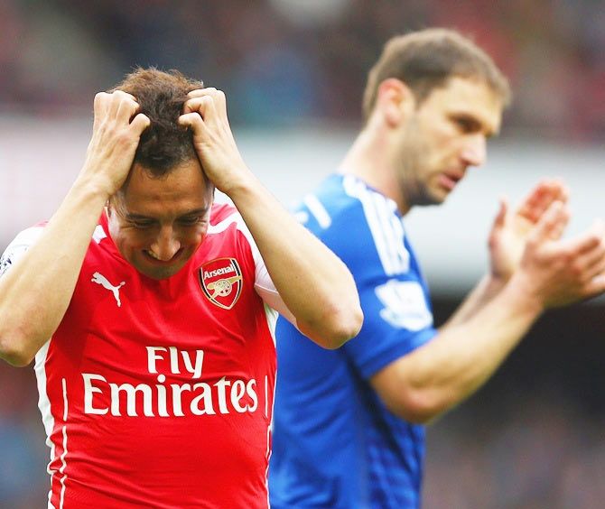 Santi Cazorla (left) of Arsenal reacts after a missed chance