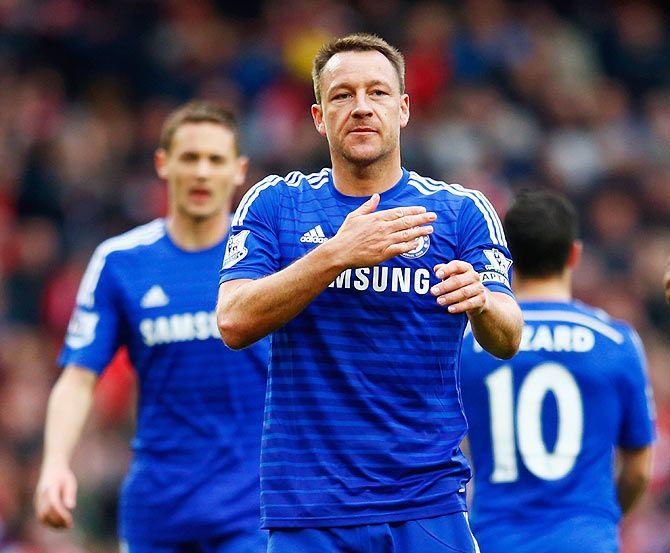 Chelsea's John Terry celebrates with teammates after holding Arsenal to a draw during their English Premier League match at Emirates Stadium in London on Sunday