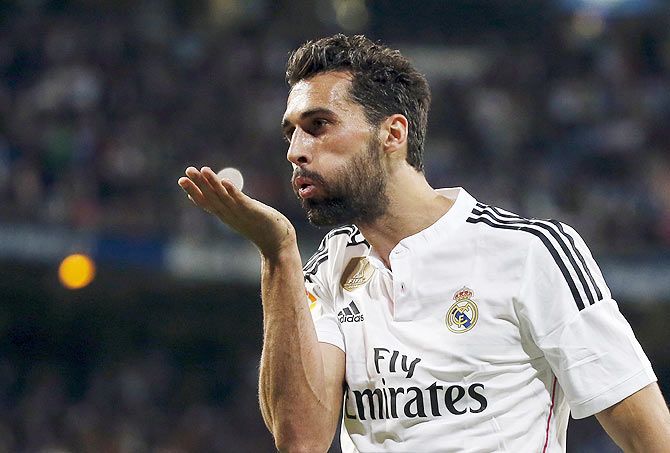 Real Madrid's Alvaro Arbeloa blows a kiss as he celebrates after scoring against Almeria