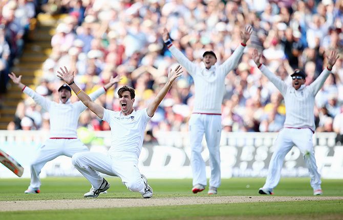 England's Steven Finn is joined by teammates as he appeals unsuccessfully for the wicket of Australia's Mitchell Marsh on Day 2 of the 3rd Ashes Test at Edgbaston in Birmingham on July 30