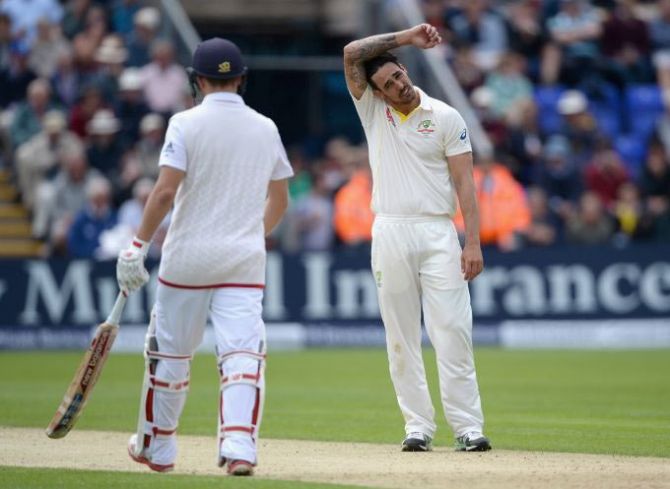 Australia's Mitchell Johnson reacts after bowling to England's Gary Ballance