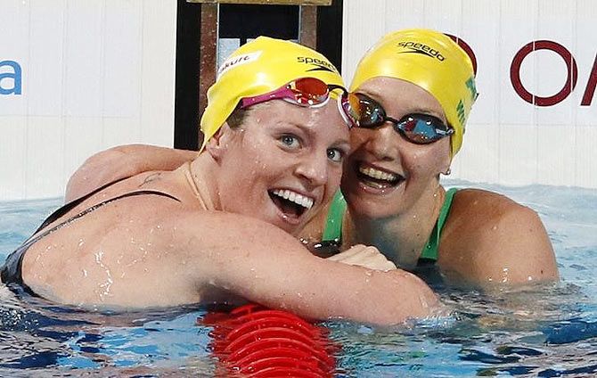 First placed Australia's Emily Seebohm celebrates with her compatriot and second placed Madison Wilson (right) after the women's 100m backstroke final