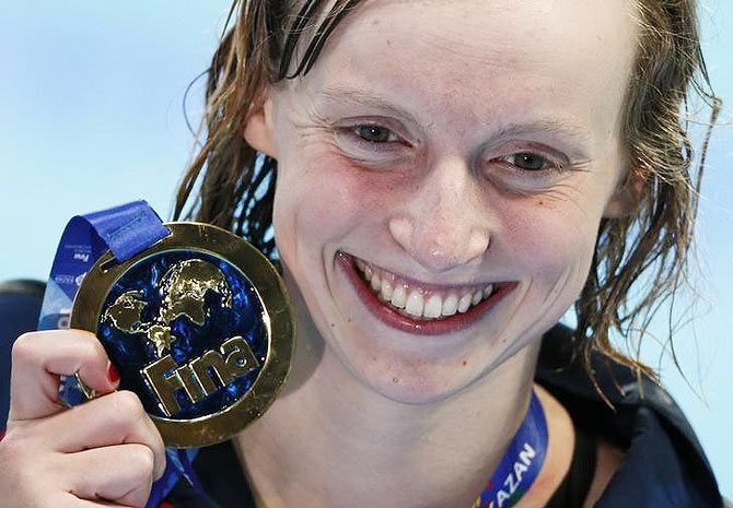 USA's Katie Ledecky poses with her gold medal after the women's 1500m freestyle final.