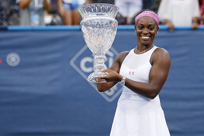 Sloane Stephens poses with the champions' trophy after her match against Anastasia Pavlyuchenkova in the women's singles final of the 2015 Citi Open at Rock Creek Park Tennis Center in Washington DC on Saturday