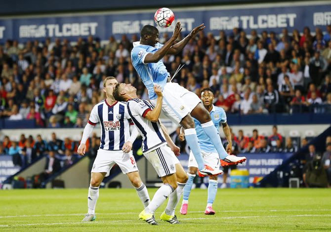 Manchester City's Yaya Toure in action with West Brom's James Chester during their English Premier League match on Monday