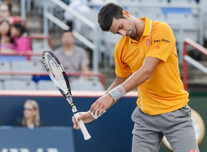Novak Djokovic reacts after losing a point against Thomaz Bellucci