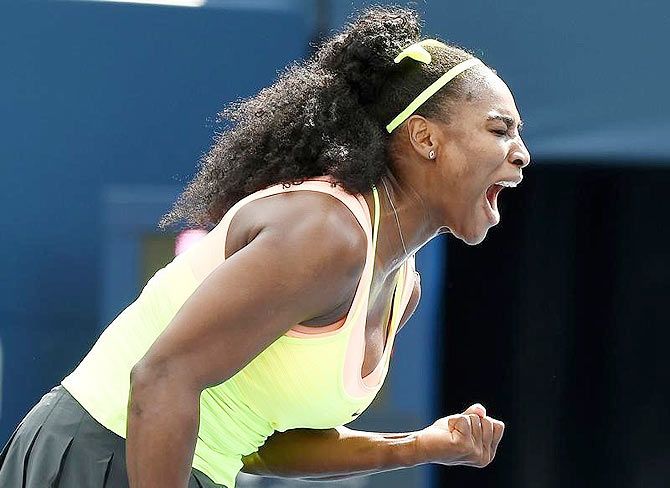 USA's Serena Williams reacts after winning a point against Italy's Flavia Pennetta during their Rogers Cup first round match at Avival Centre in Toronto