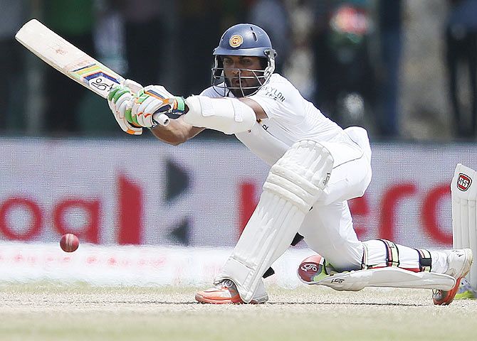 Sri Lanka's Dinesh Chandimal plays a sweep shot on Day 3 the first Test against India in Galle on Friday