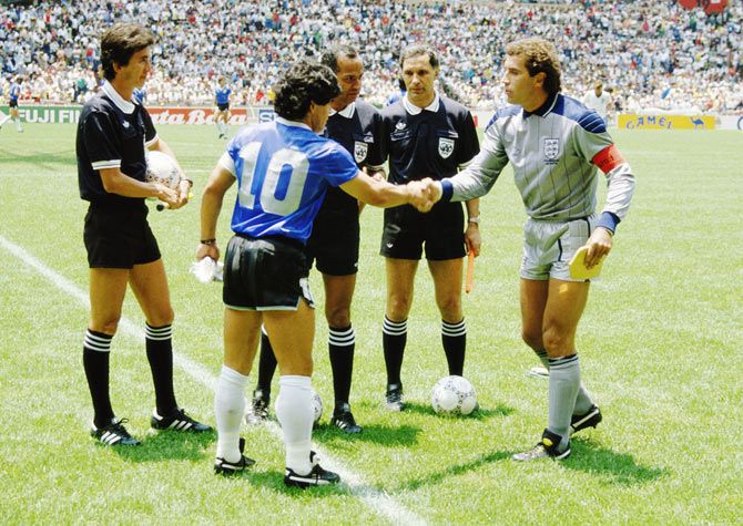 Argentina captain Diego Maradona shakes hands with England captain Peter Shilton before the 1986 FIFA World Cup quarter-final on 22 June 1986 at the Azteca Stadium in Mexico City, Mexico