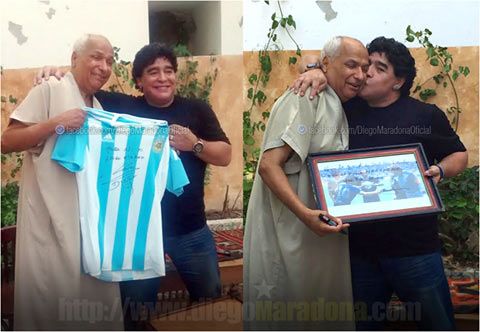 Diego Maradona greets Tunisian referee Ali Bennaceur as they pose for pictures in Tunis on Monday