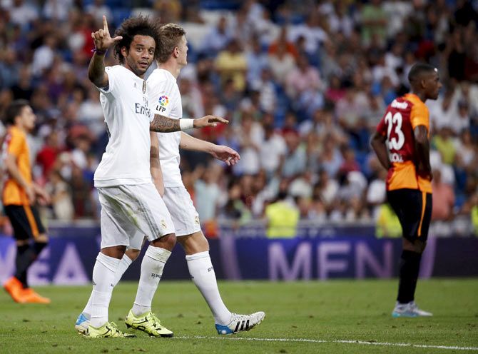 Real Madrid's Marcelo celebrates his goal during their Santiago Bernabeu Trophy friendly match against Galatasaray at Santiago Bernabeu stadium in Madrid on Tuesday
