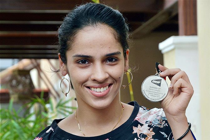 Saina Nehwal with herWorld Championship silver medal during her interaction with the media at her residence on Tuesday