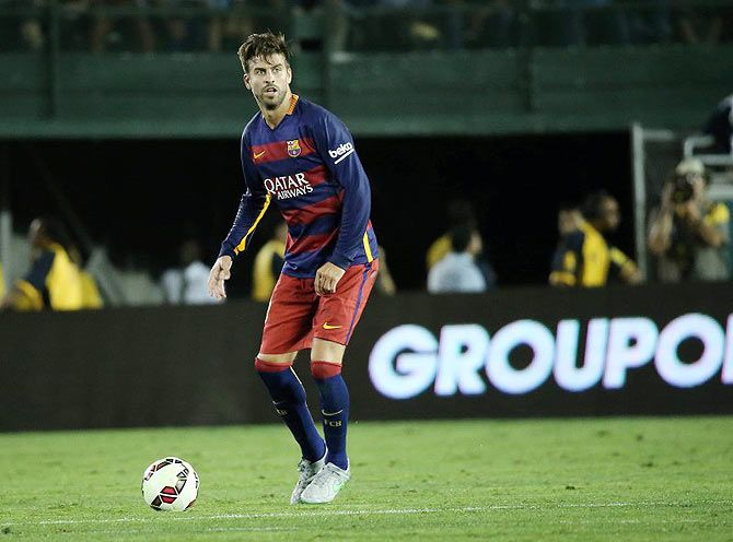 Barcelona defender Gerard Pique (3) controls the ball