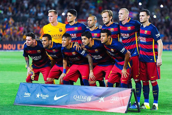 FC Barcelona players pose for a team picture 