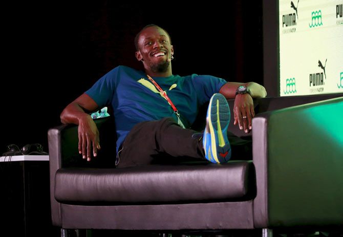 Jamaican sprinter Usain Bolt relaxes at a news conference ahead of the IAAF (International Association of Athletics Federations) World Championships, in Beijing, on Thursday